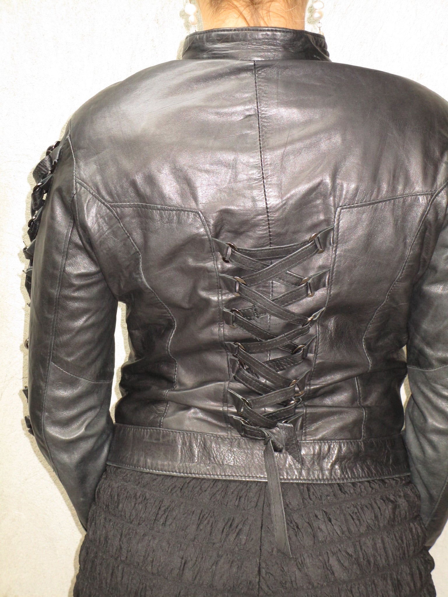 BLACK LEATHER JACKET WITH TIE DETAIL
