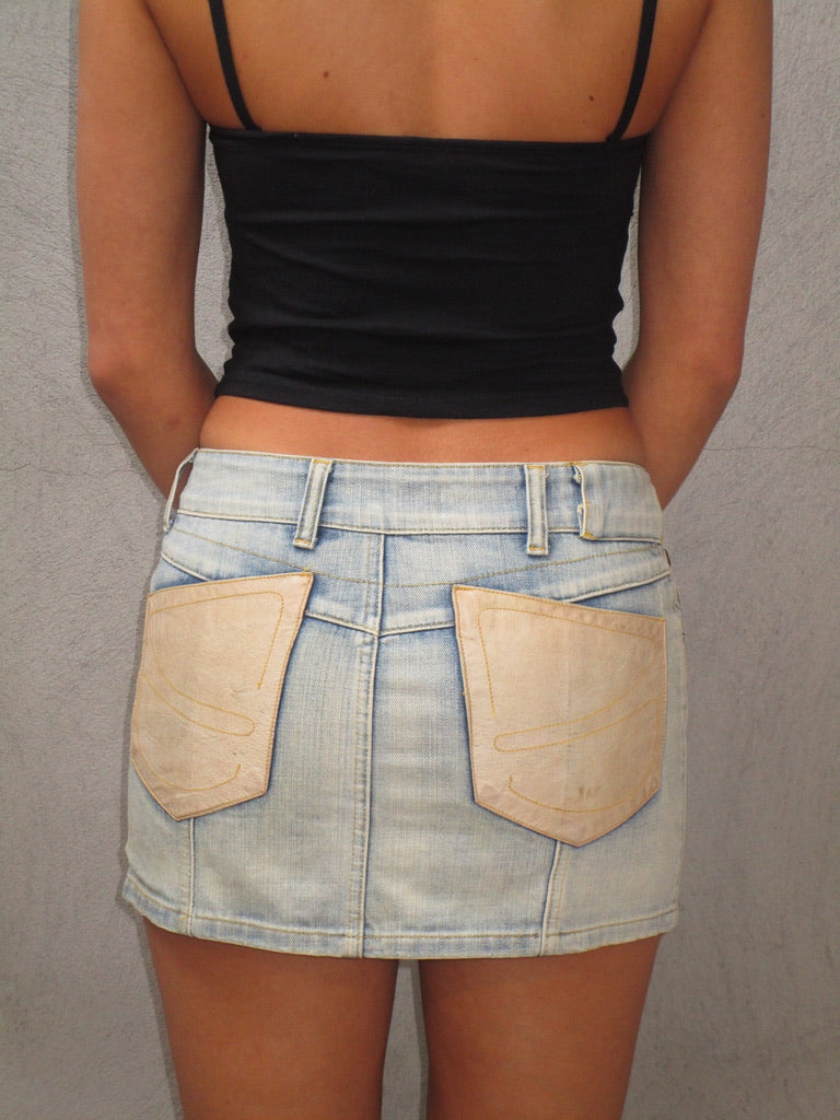 Denim mini skirt with leather pockets