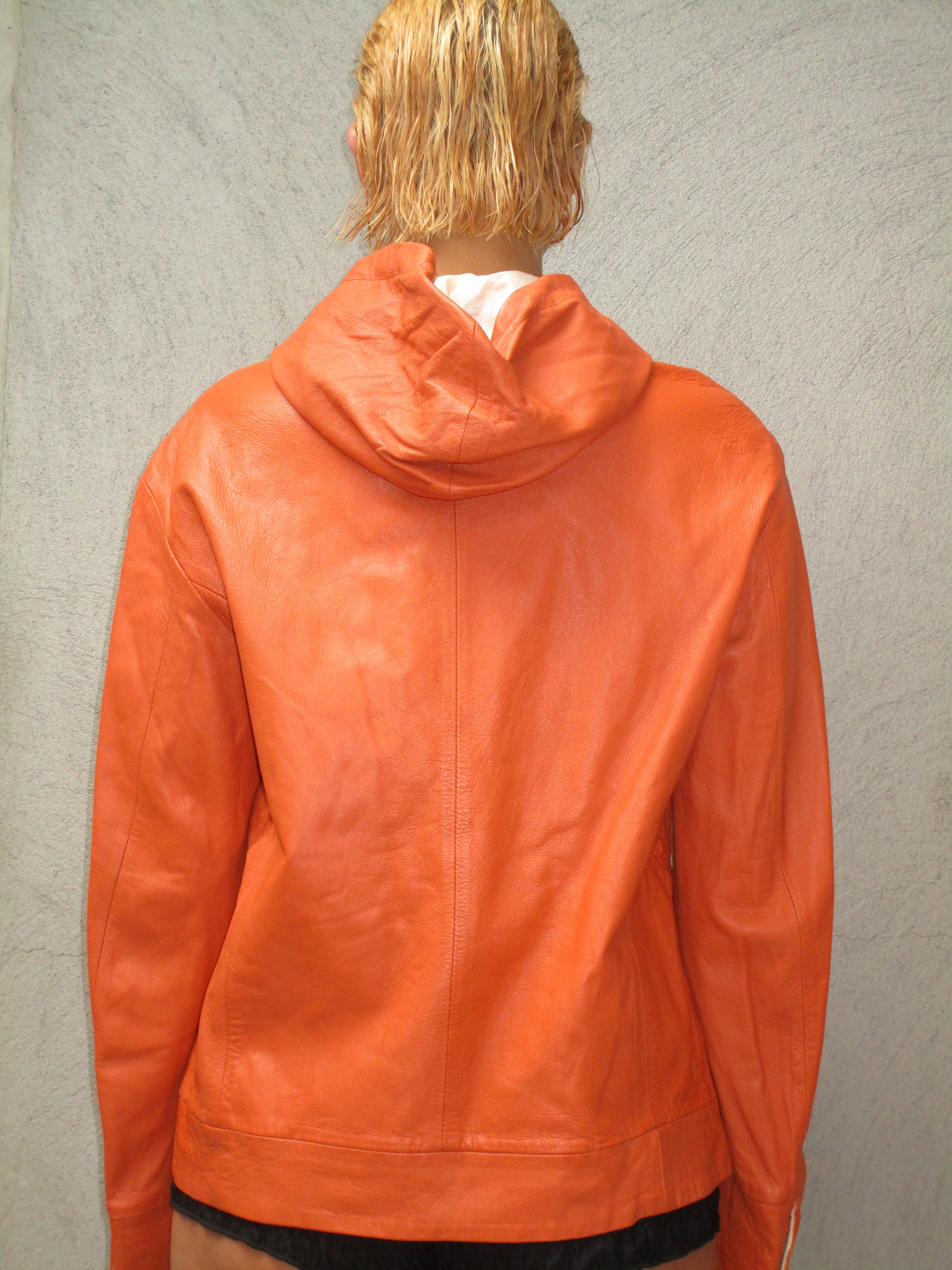 Orange leather jacket with a hood