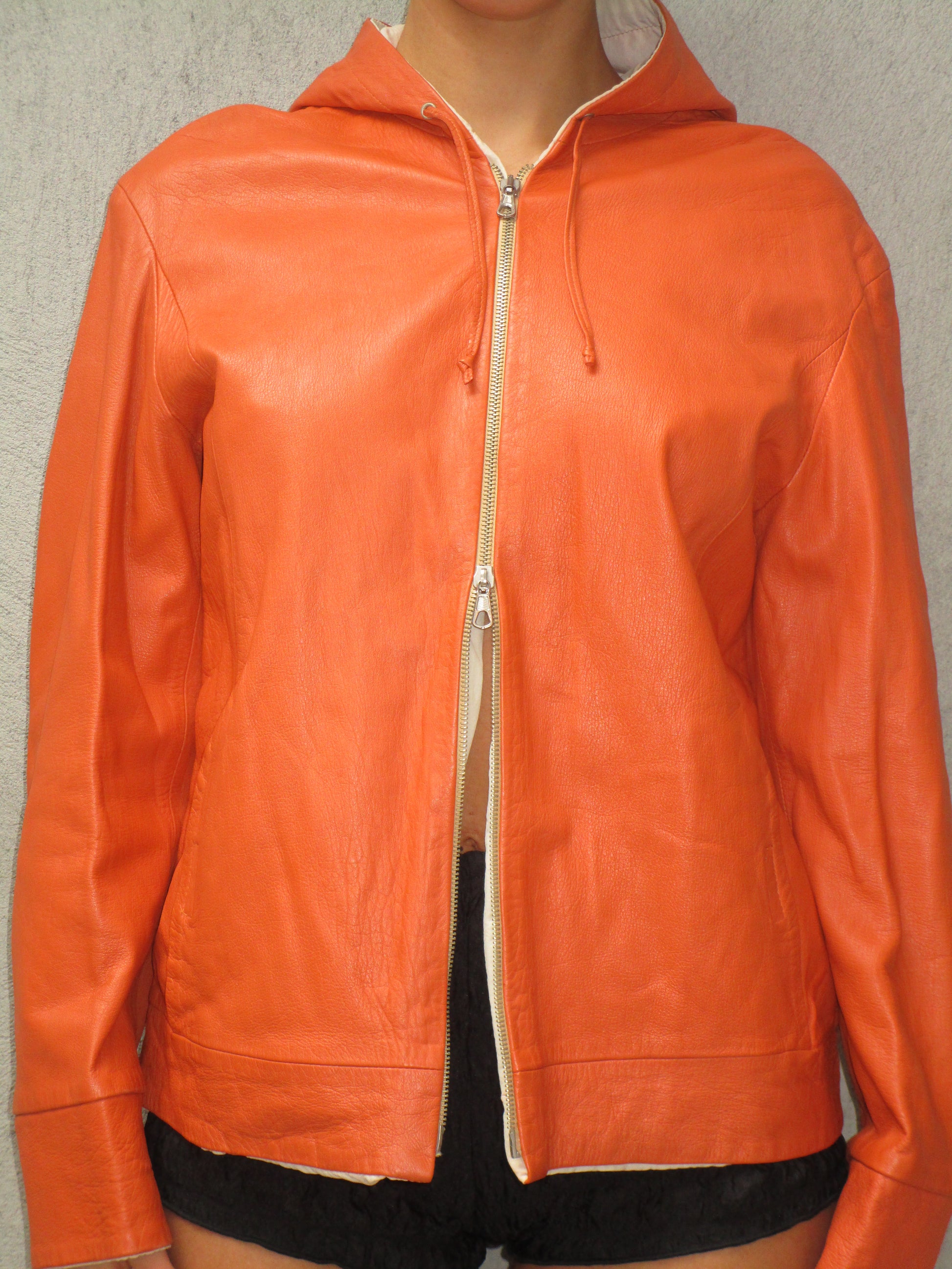 Orange leather jacket with a hood